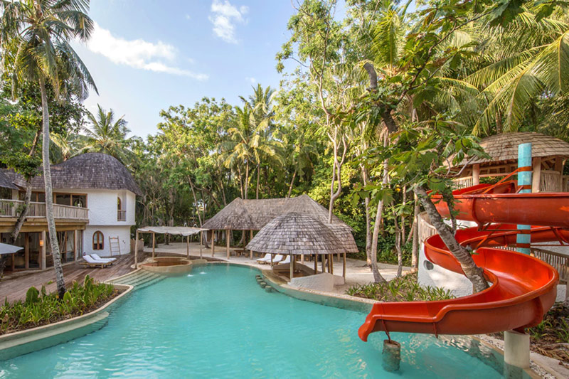 Soneva Fushi's Children's Pool at The Den Kids Club - Complete with a Spiralling Red Water Slide!